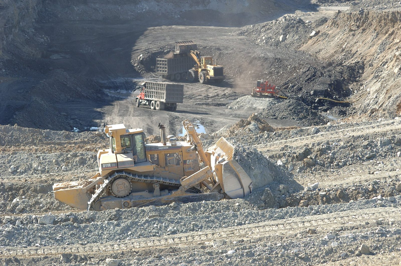 Heavy equipment regrading ground at a coal mine site overseen by the Office of Surface Mining (Horse Creek Mine area, Illinois).